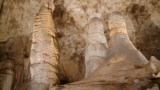 A highly decorated area can be illuminated using the lanterns on the guided tour of Carlsbad Cavern.