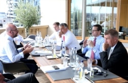 FILE - President of the European Council Charles Michel meets with prime ministers of Czech Republic, Poland, Hungary and Slovakia during European Union Council over a post-virus economic rescue plan, in Brussels, Belgium, July 19, 2020.