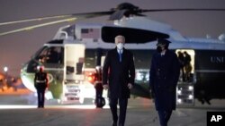 President Joe Biden walks to board Air Force One for a trip to Camp David, Feb. 12, 2021, in Andrews Air Force Base, Md.