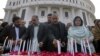 Pakistani lawmakers from provincial Khyber Pakhtunkhwa assembly light candle during a ceremony to mark second anniversary of a Taliban attack in 2014 on a school in Peshawar, Dec. 16, 2016.