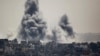 Smoke rises during an Israeli offensive in the east of Gaza City July 27, 2014.
