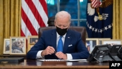 US President Joe Biden signs executive orders related to immigration 