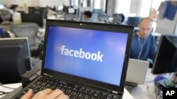 FILE - This photo shows a view inside Facebook headquarters in Menlo Park, Calif. Facebook announced Tuesday, Oct. 22, 2013, it was working on new ways to keep users from stumbling across gruesome content on its website following an outcry over the discovery of beheading videos there. (AP Photo)