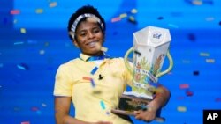 FILE - Zaila Avant-garde, 14, from Harvey, La., celebrates with the championship trophy after winning the finals of the 2021 Scripps National Spelling Bee at Disney World, July 8, 2021, in Lake Buena Vista, Fla.