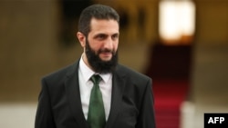FILE - A handout picture released by Syria's transitional government shows the country's new leader Ahmed al-Sharaa at the presidential palace in Damascus, Jan. 16, 2025.