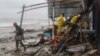 Bangladeshi rescue workers search for survivors after Cyclone Roanu hit Chittagong, May 21, 2016. Cyclone Roanu struck the Bangladesh coast forcing hundreds of thousands to flee their homes as the storm unleashed strong winds and heavy rains. 