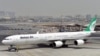 FILE - A picture taken on September 14, 2017, shows an Airbus A340 of Mahan Air at the tarmac at Dubai's International Airport.