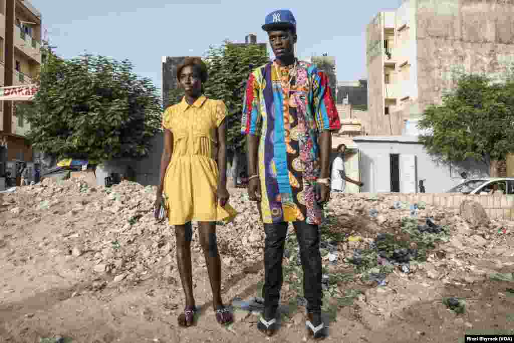 Katy and Fallou pose for a portrait in Dakar's Niary Tally neighborhood, the working class area where Dakar Fashion Week held their "Street Show" fashion show this year, June 29, 2017.