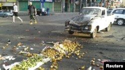 Kerusakan di lokasi ledakan bom bunuh diri di Sweida, Suriah, 25 Juli 2018.