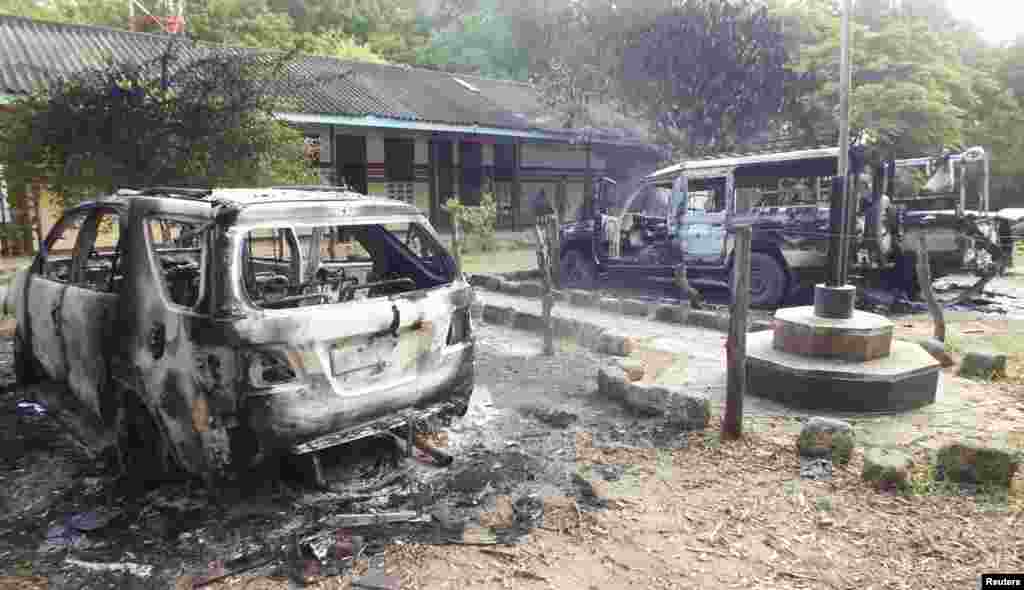 Wreckages of burnt cars are seen outside the Mpeketoni police station after gunmen attacked the coastal Kenyan town, June 16, 2014.
