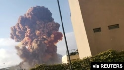 Smoke rises after an explosion in Beirut, Lebanon, Aug. 4, 2020, in this picture obtained from a social media video. (Karim Sokhn/Instagram/Ksokhn + Thebikekitchenbeirut/via Reuters) 