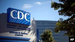 FILE - A sign marks the entrance to the Centers for Disease Control and Prevention, in Atlanta, Georgia, Oct. 8, 2013.