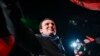 FILE - Albin Kurti, leader of the Self-Determination movement (Vetevendosje), arrives to address a celebrating crowd in the Kosovo capital of Pristina, early Monday, Oct. 7, 2019. 