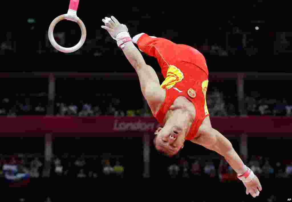 Chinese gymnast Chen Yibing performs on the rings during the Artistic Gymnastic men's team final, July 30, 2012.