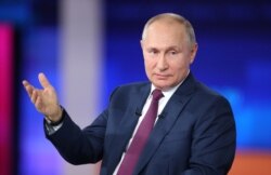 FILE - Russian President Vladimir Putin speaks during an annual nationwide televised phone-in show in Moscow, Russia, June 30, 2021.