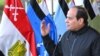 Egyptian President Abdel-Fattah el-Sissi speaks with students during a visit to training and rehabilitation programs at the Military Academy in Cairo, Egypt, Feb. 19, 2018.