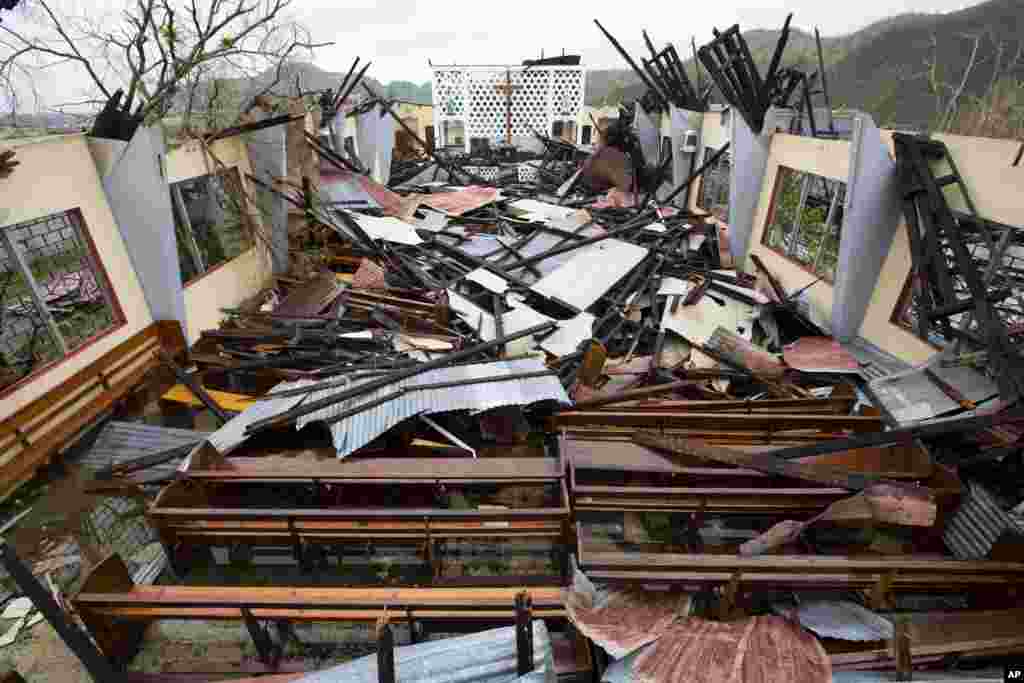 Saint Anne church lays destroyed by Hurricane Matthew in Camp Perrin, a district of Les Cayes, Haiti, on October 6, 2016. Two days after the storm rampaged across the country's remote southwestern peninsula, authorities and aid workers still lack a clear