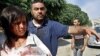 Azaz Residents Pick Up After Aerial Bombings