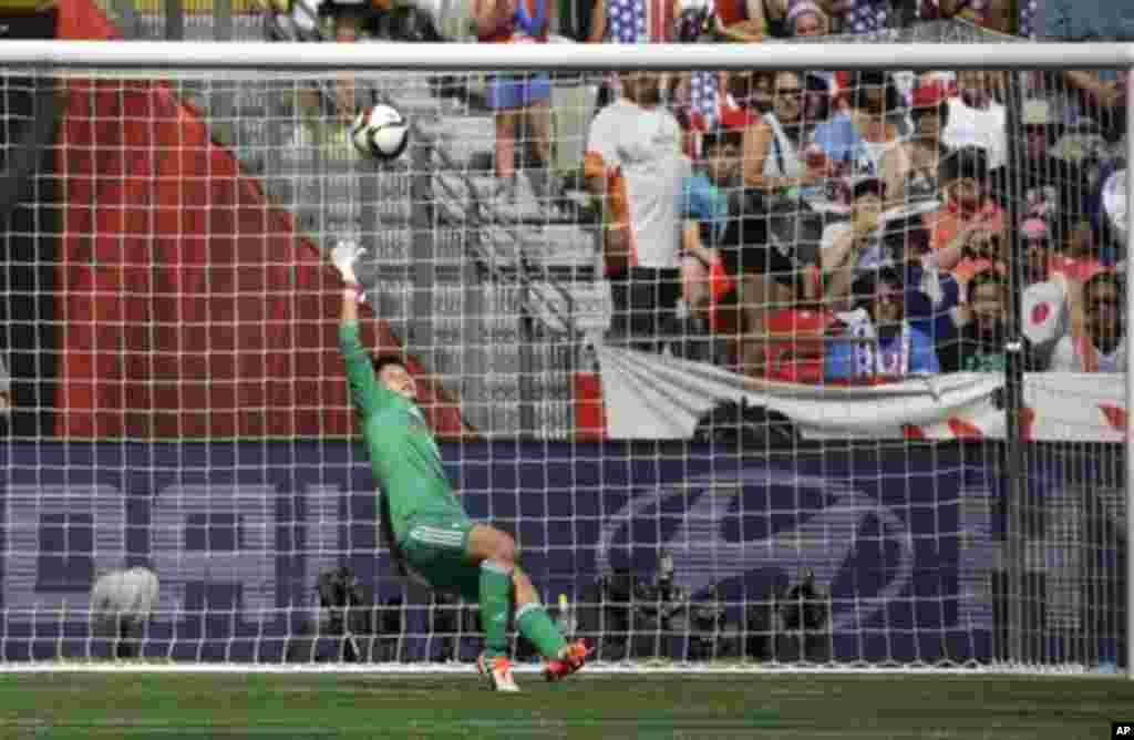 Japan's goalkeeper Ayumi Kaihori tries, but can't save a goal scored by United States' Carli Lloyd during the first half of the FIFA Women's World Cup soccer championship in Vancouver, British Columbia, July 5, 2015.