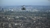Trump visits fire-stricken California, vows 'to get it fixed'