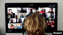 FILE - A student takes classes online using Zoom during the coronavirus outbreak, in El Masnou, north of Barcelona, Spain, April 2, 2020.