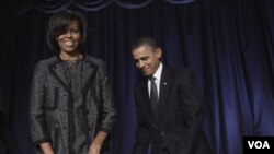 Presiden Barack Obama dan Michelle Obama saat tiba pada acara 'National Prayer Breakfast' di Washington, Kamis (3/2).