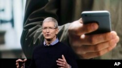 Apple CEO Tim Cook speaks at an event to announce new products at Apple headquarters, March 21, 2016, in Cupertino, California. 