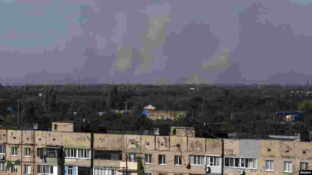 Smoke rises in the sky after shelling on the outskirts of Donetsk, eastern Ukraine, Sept. 20, 2014.
