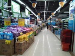 A customer walks in a supermarket in Wuhan, Hubei province, China Jan. 29, 2020, in this picture obtained from social media.