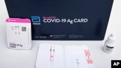 This image provided by Abbott Laboratories in August 2020 shows the company's BinaxNOW rapid COVID-19 nasal swab test. The Food and Drug Administration on Wednesday, Aug. 26, 2020, authorized BinaxNOW, the first rapid coronavirus test that doesn’t need an
