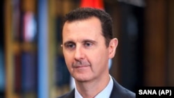 Photo d’archives : Le président syrien Bachar al-Assad lors d'un entretien avec Telesur, chaîne publique du Venezuela, à Damas, en Syrie, le 25 septembre 2015. 