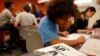 FILE - Students work in their Advanced Placement (AP) Physics class at Woodrow Wilson High School in Washington, Feb. 7, 2014. 