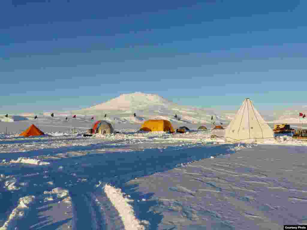 The white tent houses the combination core and melting drill used to penetrate the 200-meter thick ice shelf to gain access to the ocean below. (Scott Tyler)