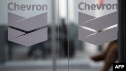 FILE - Chevron Global Technology Services Company logos are seen at an administrative office in Caracas, Venezuela, on Nov. 29, 2022.