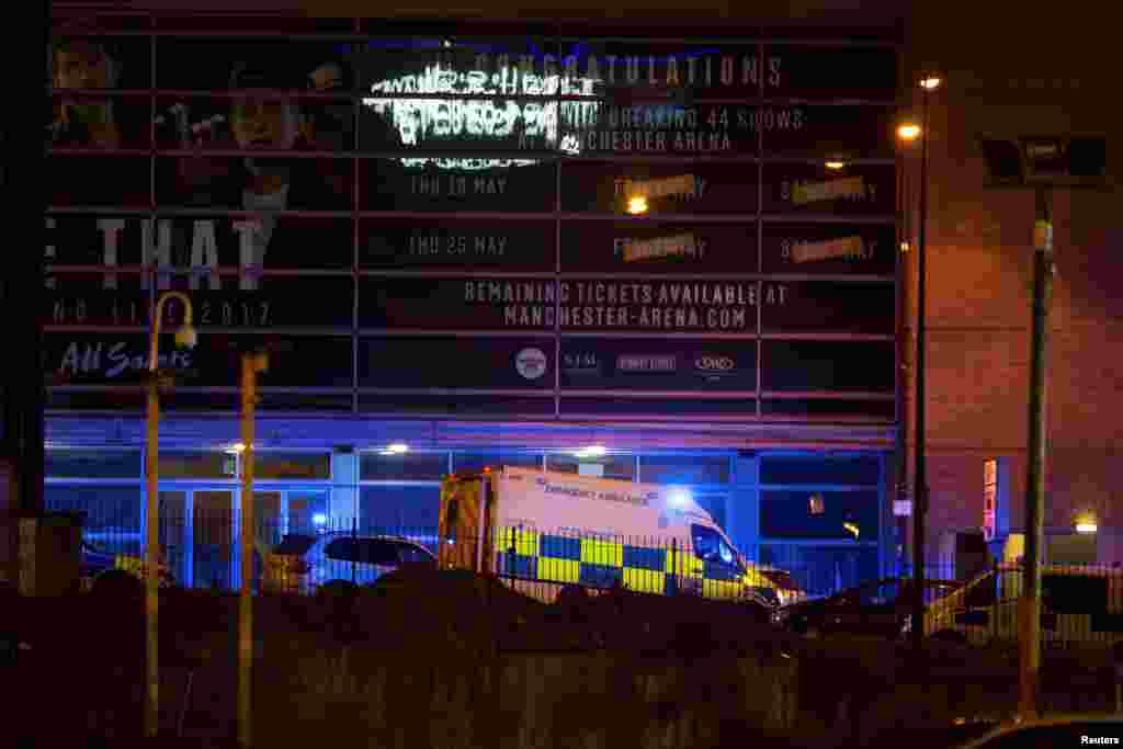 A police van and an ambulance are seen outside the Manchester Arena, where U.S. singer Ariana Grande had been performing, in Manchester, northern England, Britain May 22, 2017.