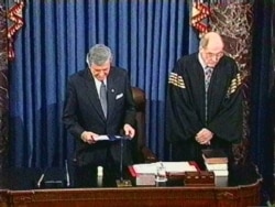 FILE - Senate chaplain Rev. Lloyd Ogilvie gives the final prayer of the impeachment trial and offers thanks for the tenor of the debate and asked for healing for President Clinton and his family on the Senate floor, Feb. 12, 1999.