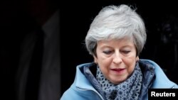 Britain's Prime Minister Theresa May leaves 10 Downing Street as she faces votes on Brexit options, in London, March 27, 2019.