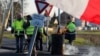 Protesters wearing yellow vests occupy a roundabout in Somain, France, Dec.13, 2018.