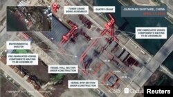 美國“戰略與國際研究中心”CSIS提供給路透社2019年4月17日的衛星照片顯示，過去6個月上海江南造船廠建造的一艘看起來是中國第三艘航母的大型船艦進度可觀。