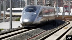 A new high-speed train arrives at the Beijing-South railway station. The landmark Beijing-Shanghai line, which costs 220.9 billion yuan and spans 1,318-km linking the capital and financial hub, June 27, 2011
