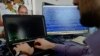 A man types on a computer keyboard in Warsaw in this Feb. 28, 2013 illustration file picture. 