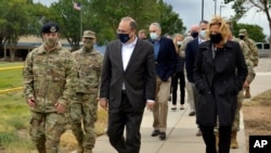 Marshall Billingslea, special presidential envoy for arms control, center, and National Nuclear Security Administration Administrator Lisa Gordon-Hagerty, right, walking with Air Force personnel between meetings in Albuquerque, N.M., Sep. 9, 2020. 