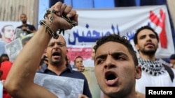 Jurnalistlar so'z erkinligining cheklanishiga qarshi namoyish o'tkazmoqda, Qohira, Misr, 10-iyun, 2015