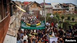 Kashmiri men shout slogans during a protest after the scrapping of the special constitutional status for Kashmir by the Indian government, in Srinagar, Aug. 11, 2019. 