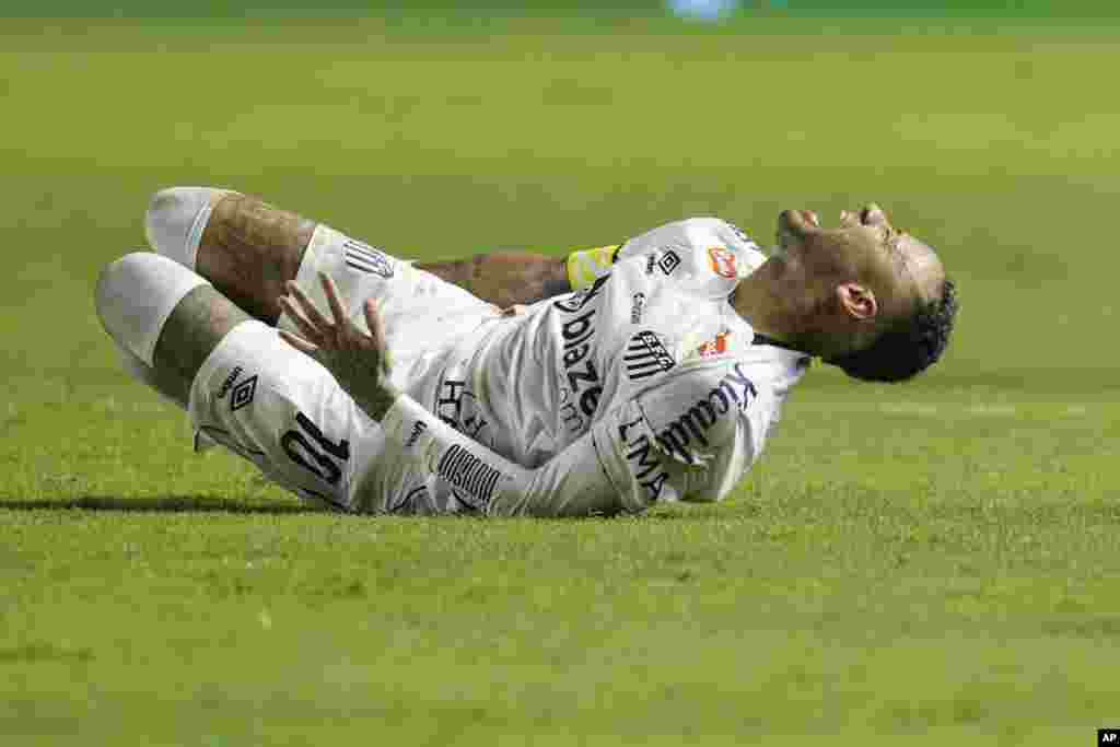 Brazil's Neymar grimaces in pain after he was fouled during his debut for Santos FC in a Sao Paulo league soccer match, against Botafogo-SP in Santos, Brazil, Feb. 5, 2025.