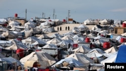 FILE - A general view of al-Hol displacement camp in Hasaka governorate, Syria, Apr. 1, 2019.