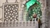 Syria's interim prime minister Mohammad al-Bashir addresses a crowd at the capital's landmark Umayyad Mosque on December 13, 2024. (Photo by Sameer Al-Doumy / AFP)