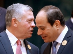FILE - Egyptian President Abdel Fattah el-Sissi, listens to Jordan's King Abdullah II, left, during a group picture ahead of Islamic Summit of the Organization of Islamic Cooperation in Mecca, Saudi Arabia, June 1, 2019.