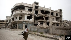 FILE - A devastated part of Homs, Syria.