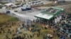 Polish Forces Use Water Cannons on Migrants Who Threw Stones